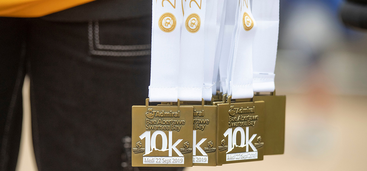 A photo of the medals from the 2019 Admiral Swansea Bay 10k